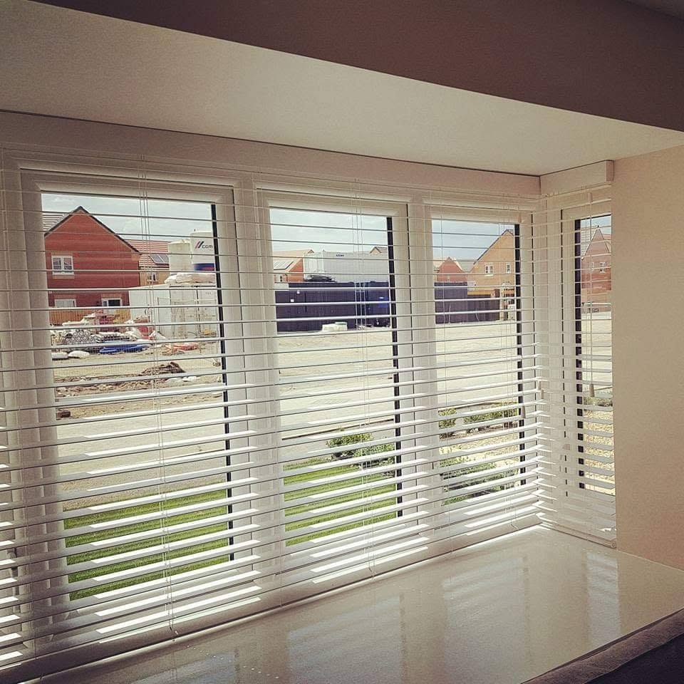 Master bedroom with linen roman blinds